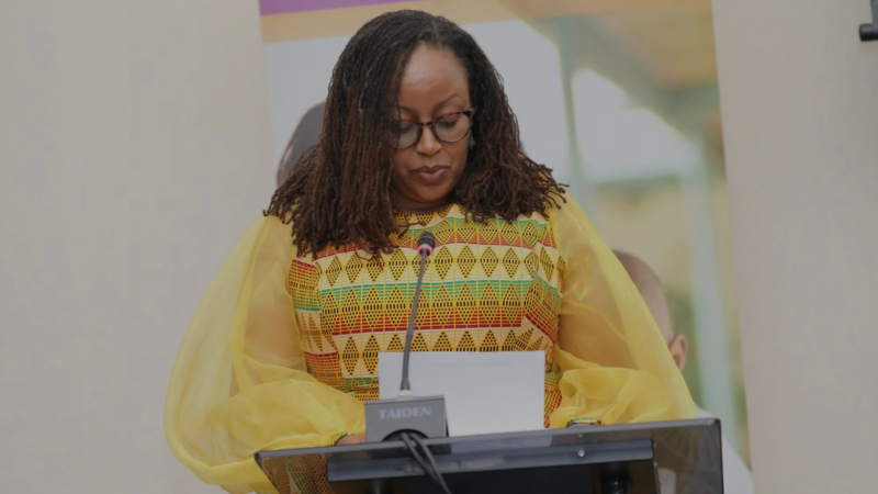 Noleen Sang-Opondo at a podium with a mic, giving opening remarks at 58th General Assembly SADC